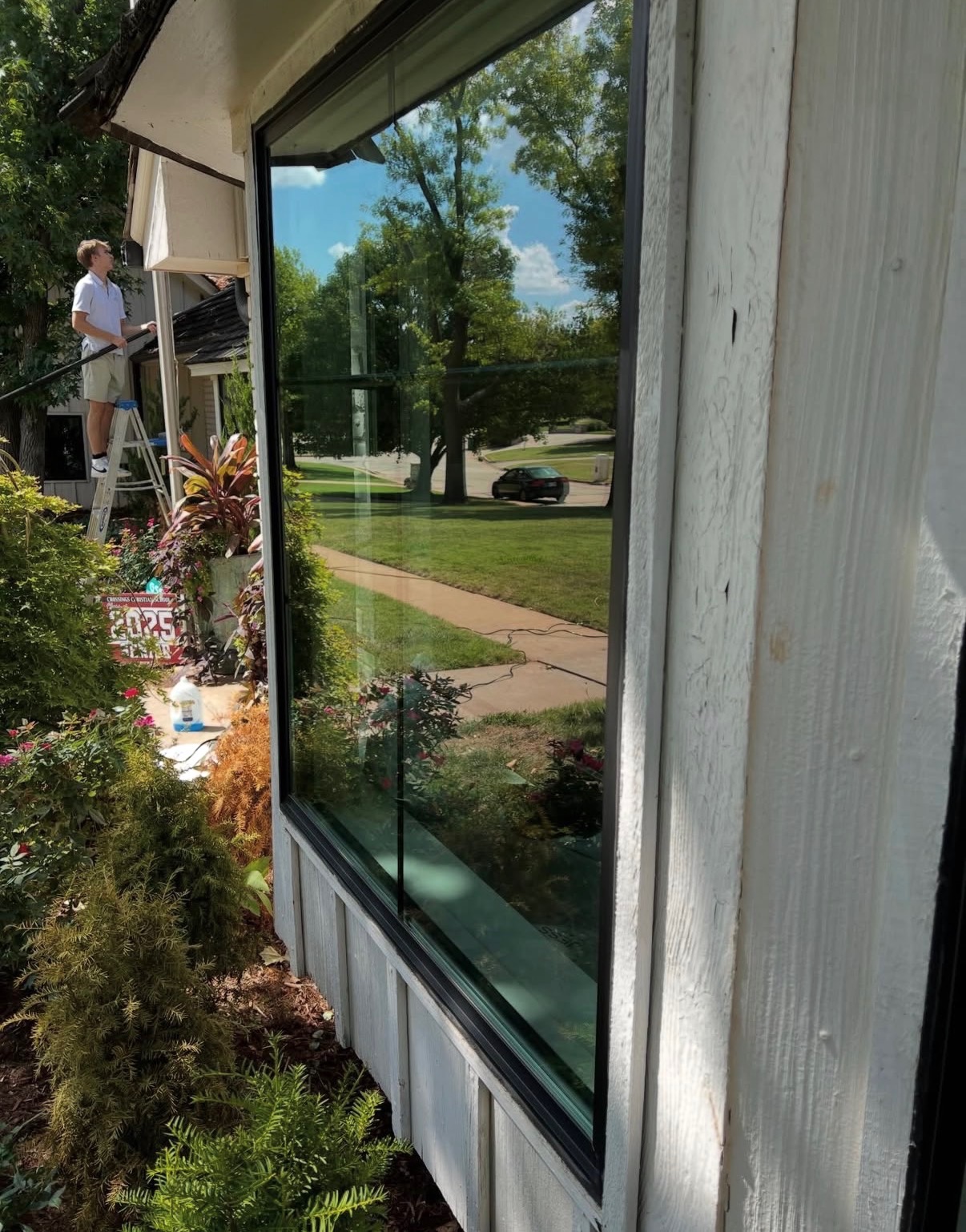 Crew cleaning upper-story windows