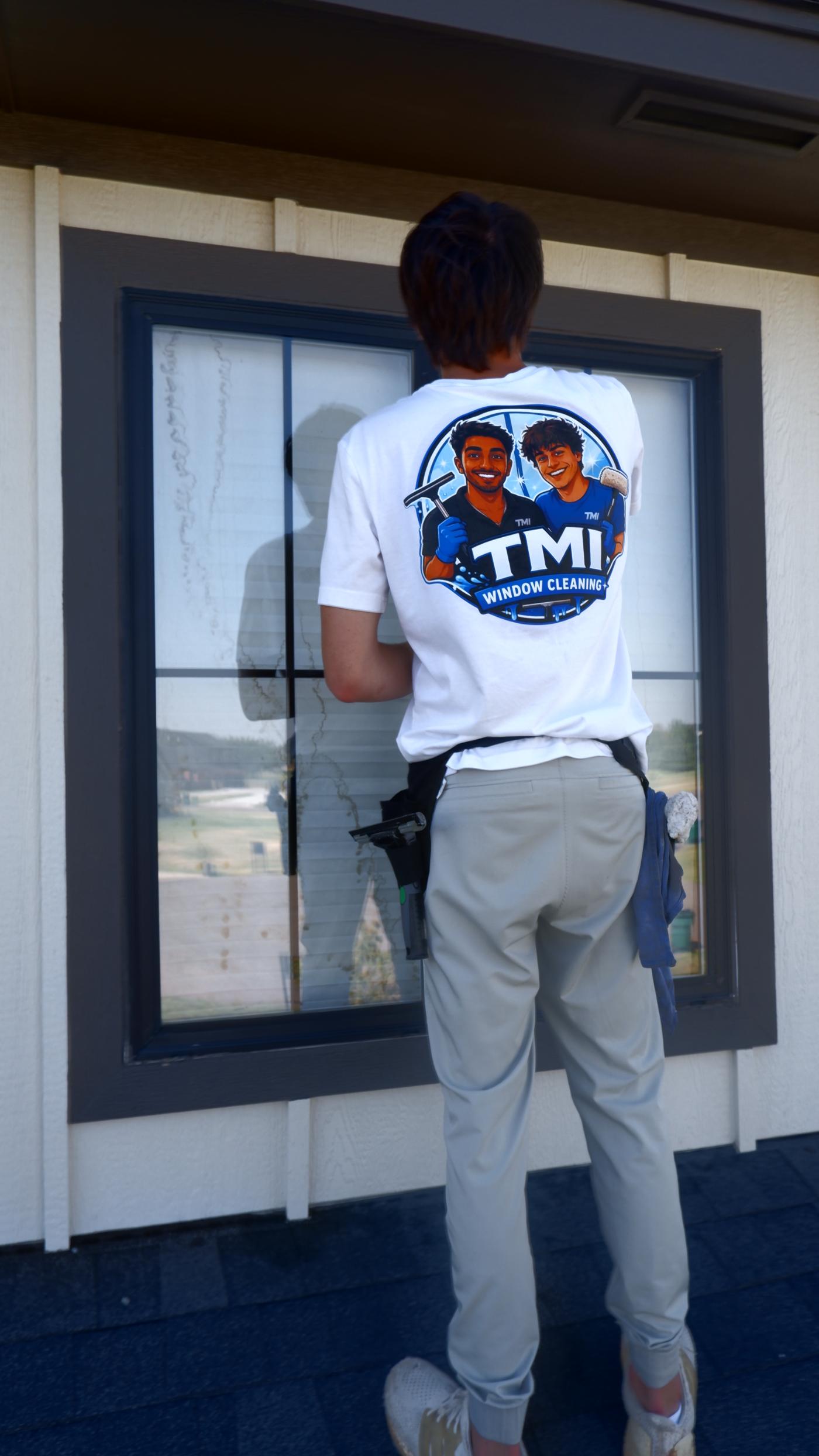 TMI crew member cleaning a window